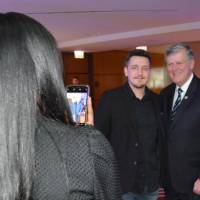 Thomas J. Haas gets a photo with an alumnus